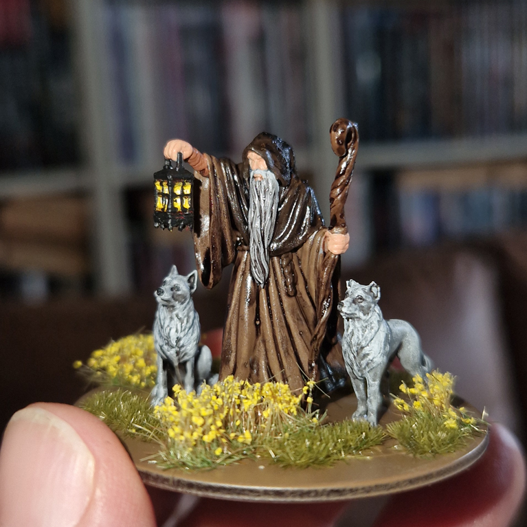 Painted miniature old man with two dogs